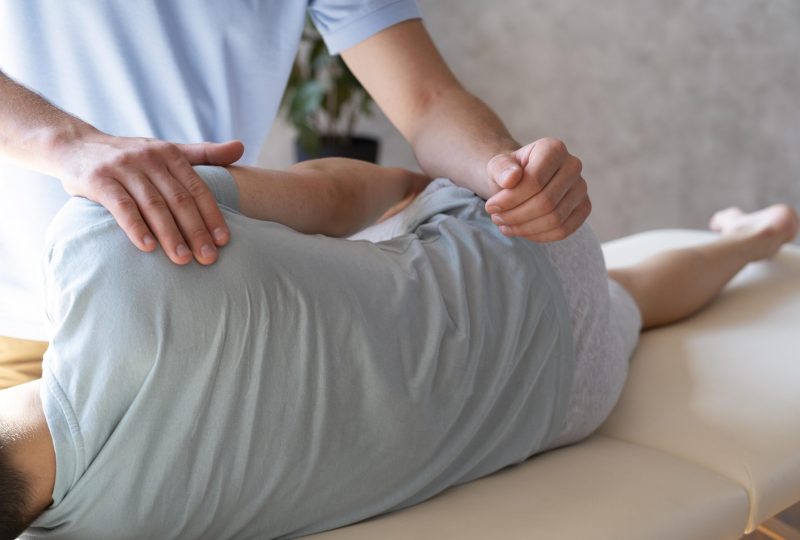 close-up-physiotherapist-helping-patient-with-pain