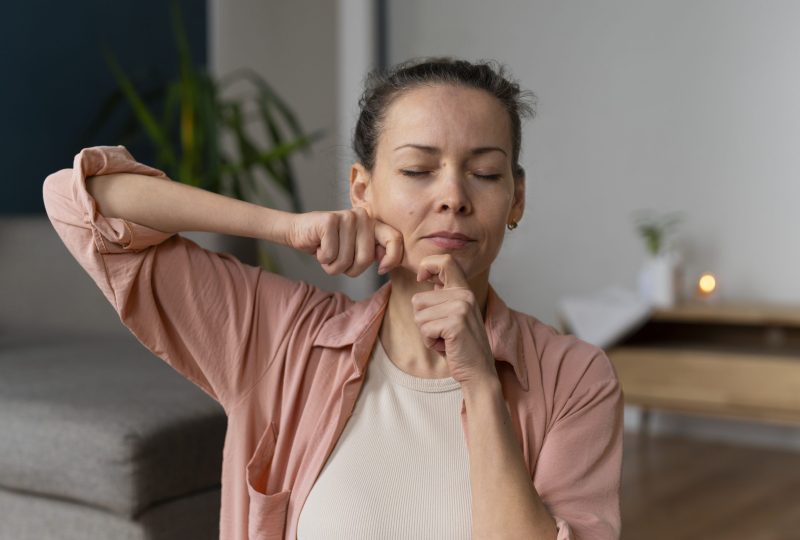 medium-shot-woman-practicing-facial-yoga